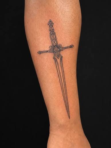 Fine-line sword tattoo by Supremacy Ink